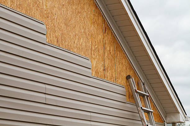 Professional Siding Installation technician working in Somerset, TX